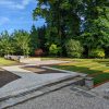 corten steel edging on lawn in big garden on sunny day