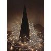 corten steel christmas tree surrounded by fairy lights