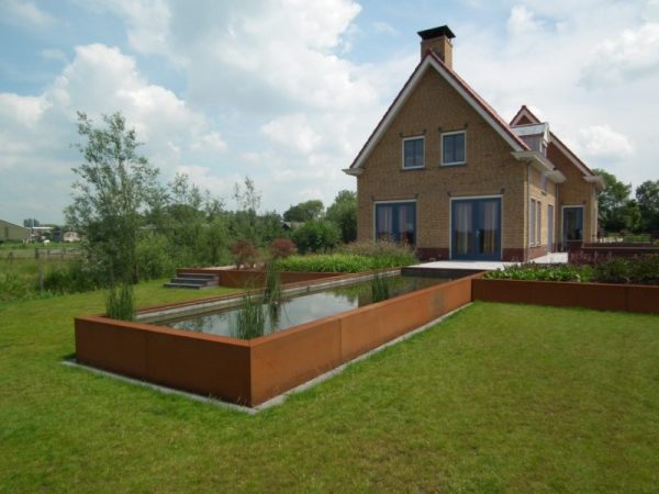 extra large corten steel pond and raised beds in garden